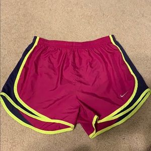 Magenta Nike shorts with navy blue & yellow